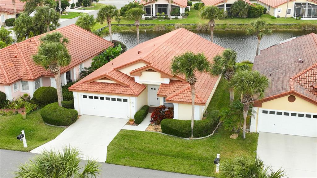 a aerial view of a house with garden space and street view