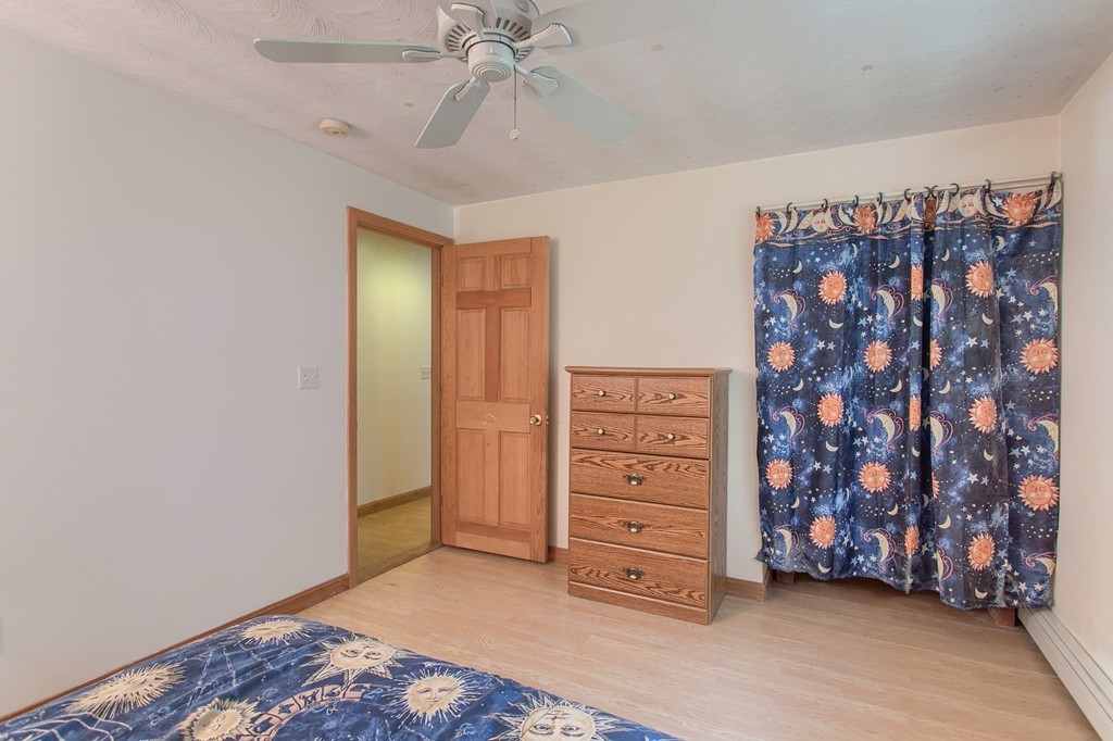 49 Clarissa Road Chelmsford, MA 01824 - Photo 19 of 25 a view of a bedroom with wooden floor and closet