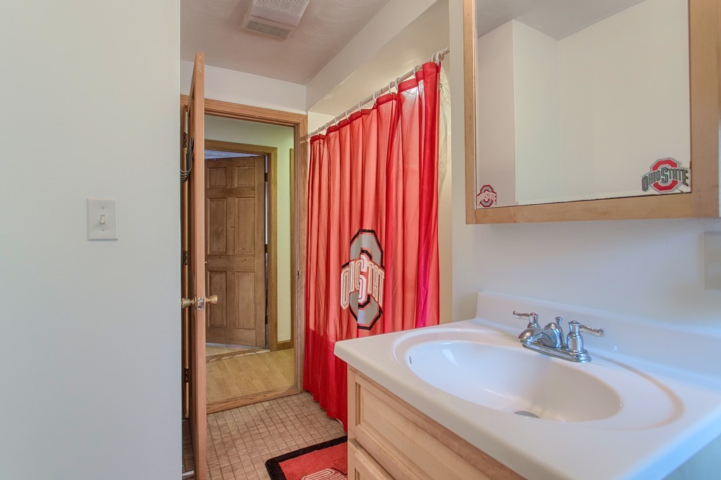 49 Clarissa Road Chelmsford, MA 01824 - Photo 20 of 25 a bathroom with a sink and a mirror