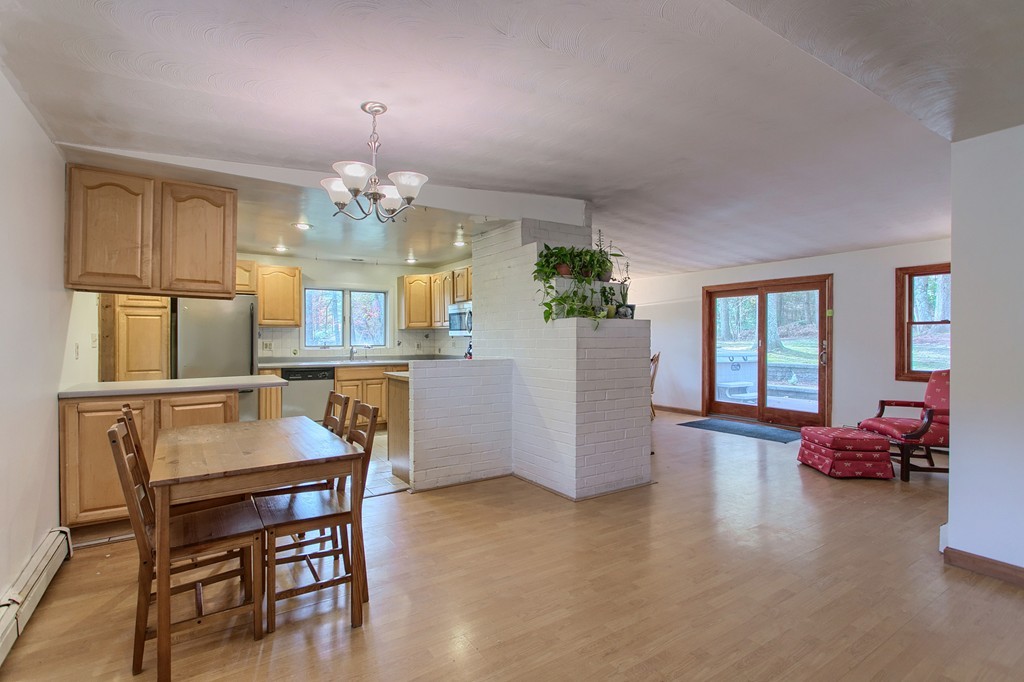 49 Clarissa Road Chelmsford, MA 01824 - Photo 2 of 25 a view of a dining room with furniture and wooden floor