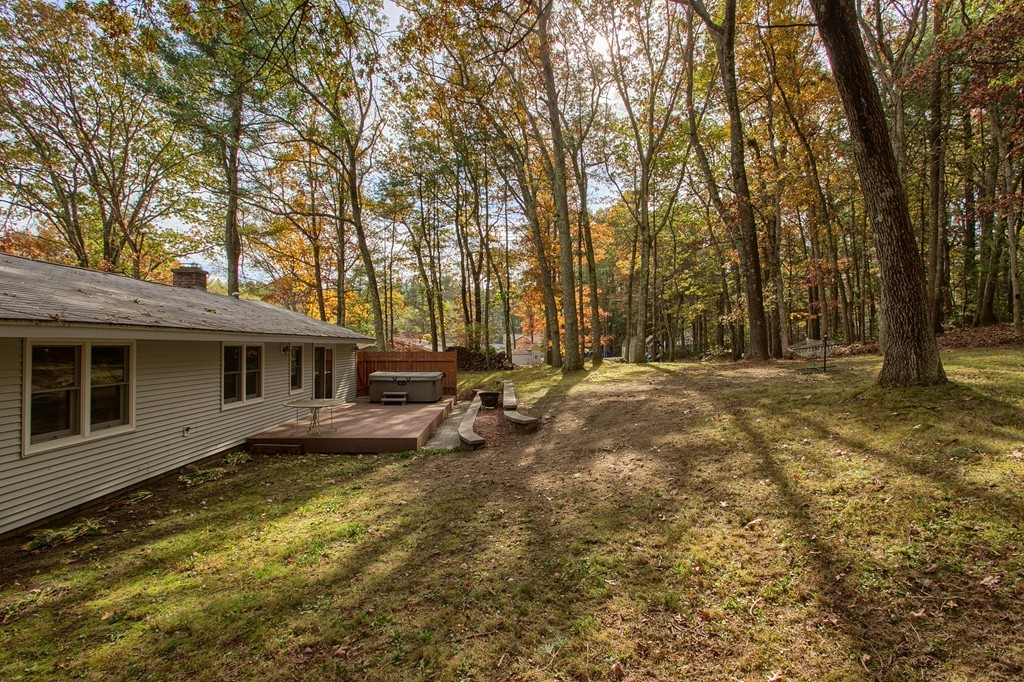 49 Clarissa Road Chelmsford, MA 01824 - Photo 25 of 25 a backyard of a house with barbeque oven table and chairs
