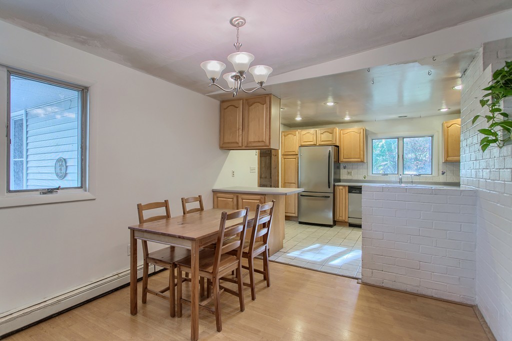 49 Clarissa Road Chelmsford, MA 01824 - Photo 5 of 25 a view of a dining room with furniture and wooden floor