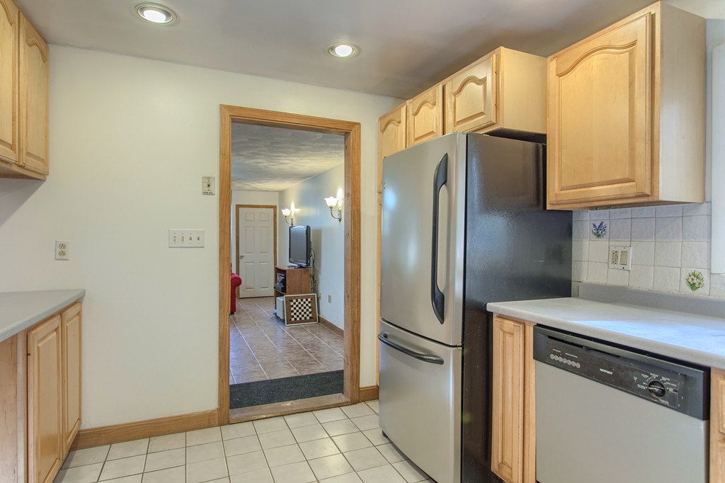 49 Clarissa Road Chelmsford, MA 01824 - Photo 8 of 25 a kitchen with stainless steel appliances granite countertop a refrigerator and a stove