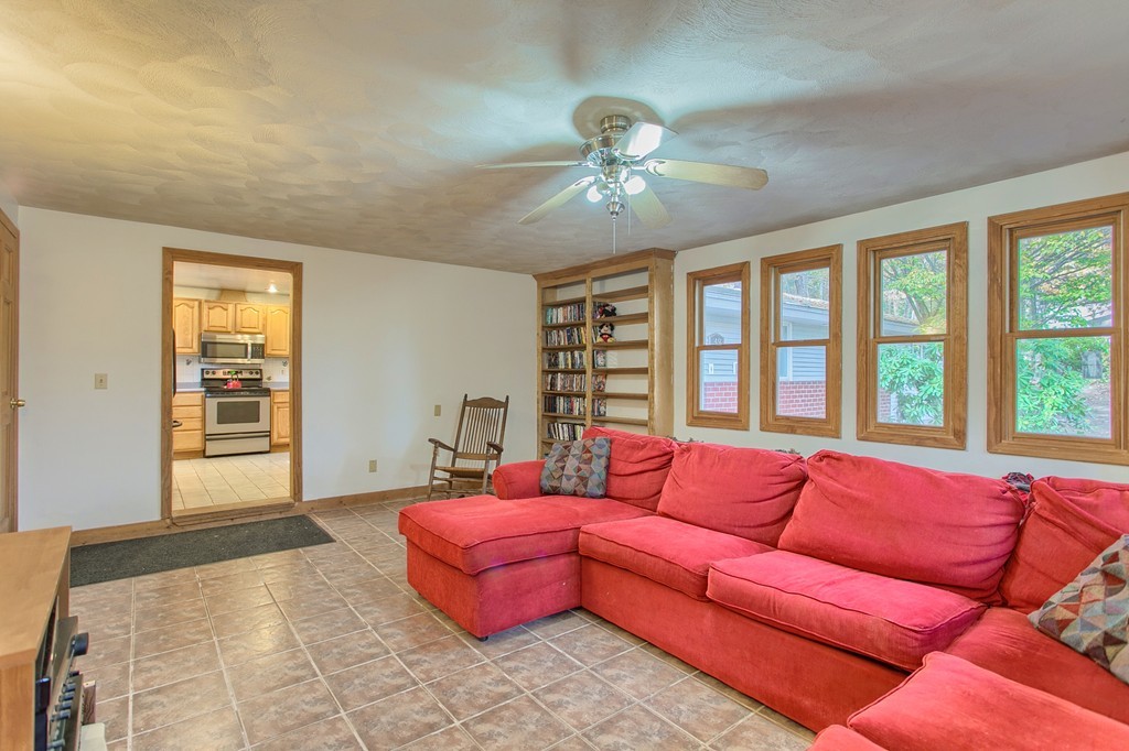 49 Clarissa Road Chelmsford, MA 01824 - Photo 10 of 25 a spacious bedroom with a bed couch and window