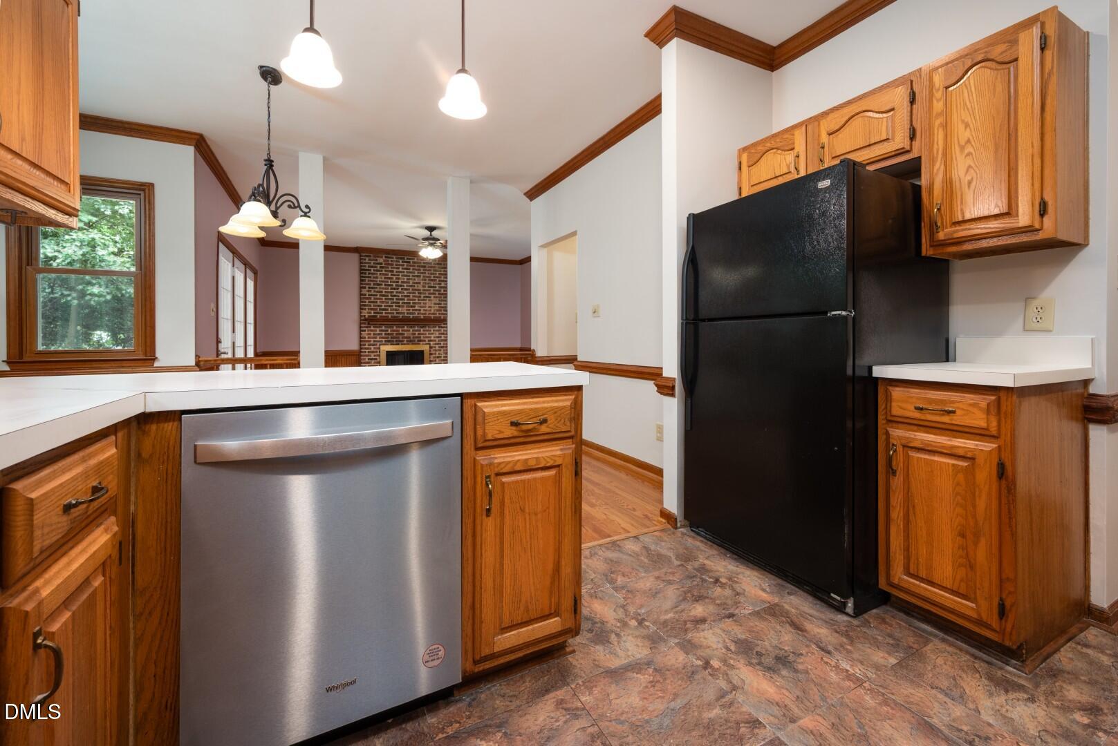 5020 Celbridge Place Raleigh, NC 27613 - Photo 22 of 52 a kitchen with stainless steel appliances a refrigerator and a stove