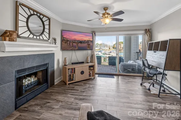 a living room with furniture and a fireplace