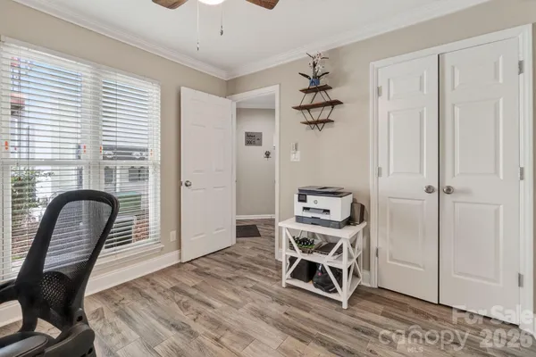 a view of a livingroom with furniture and windows