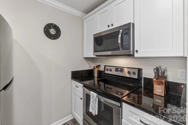 a kitchen with a stove and a microwave