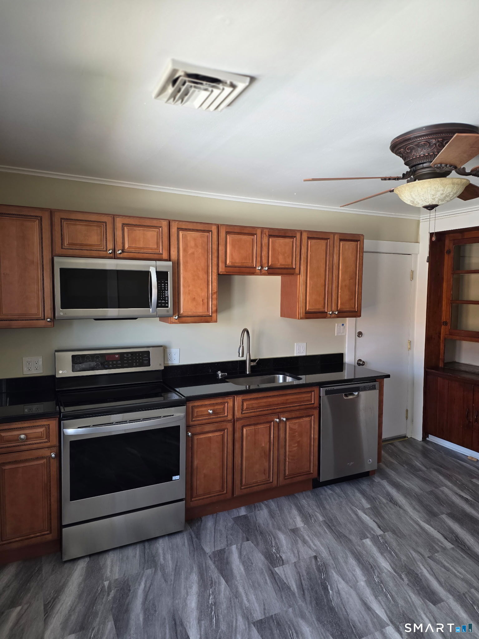 22 Calvin Avenue Wallingford, CT 06492 - Photo 2 of 10 a kitchen with stainless steel appliances granite countertop a stove and a sink