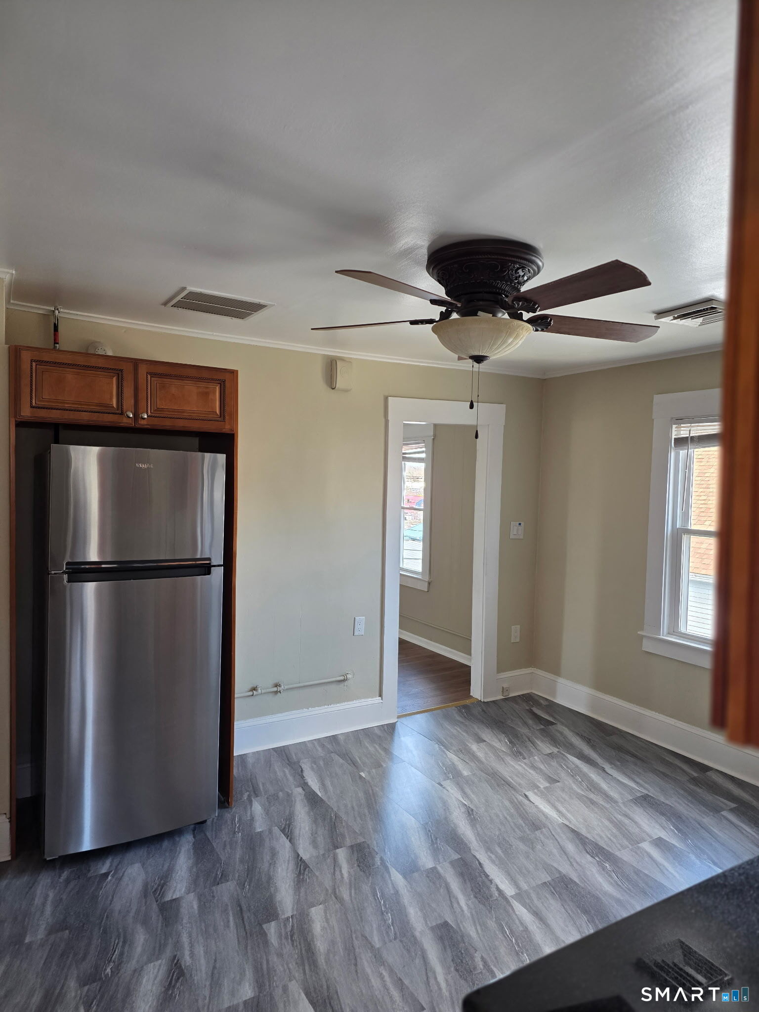 22 Calvin Avenue Wallingford, CT 06492 - Photo 3 of 10 a view of empty room with wooden floor and cabinet