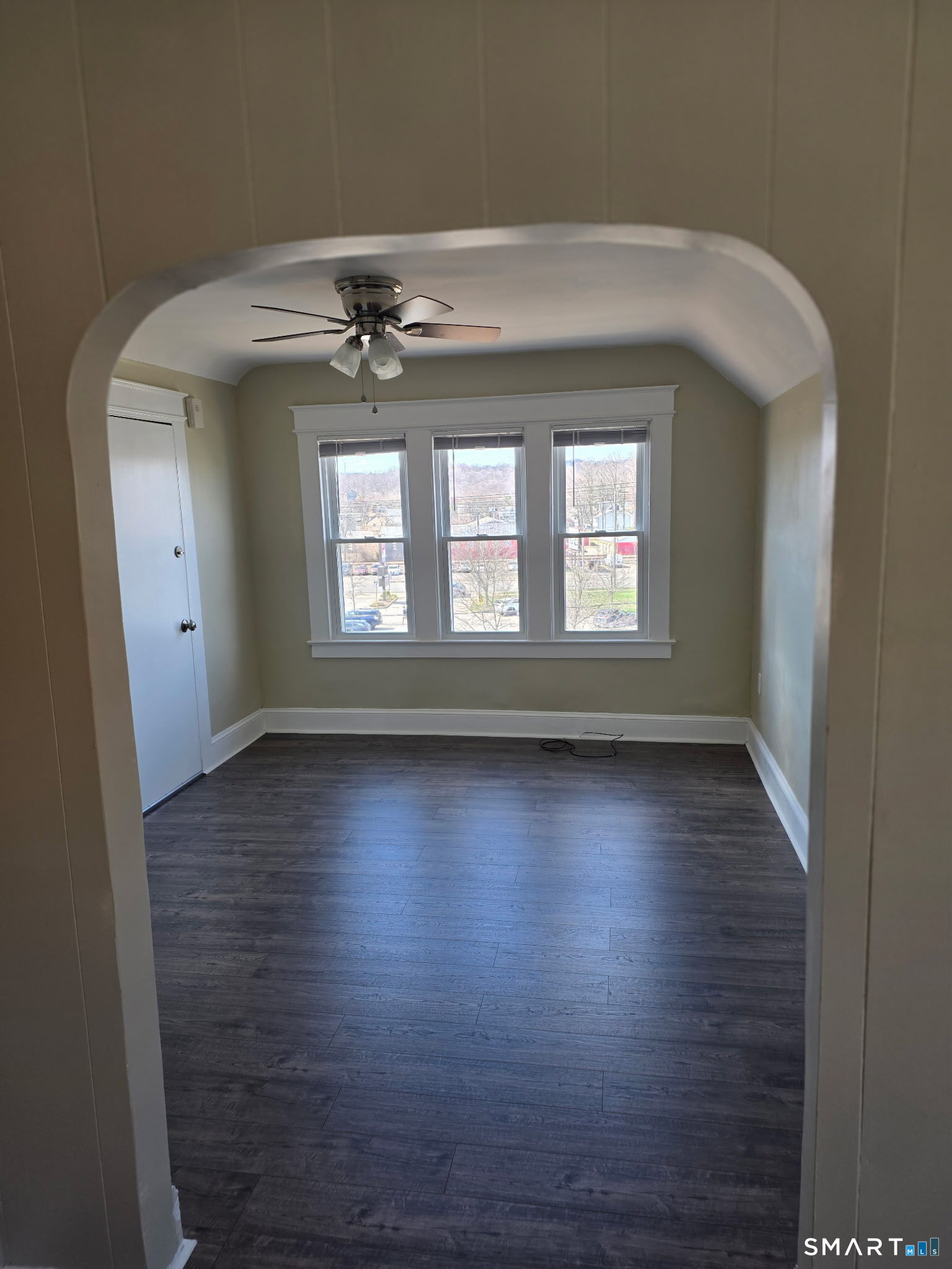 22 Calvin Avenue Wallingford, CT 06492 - Photo 5 of 10 an empty room with wooden floor and windows