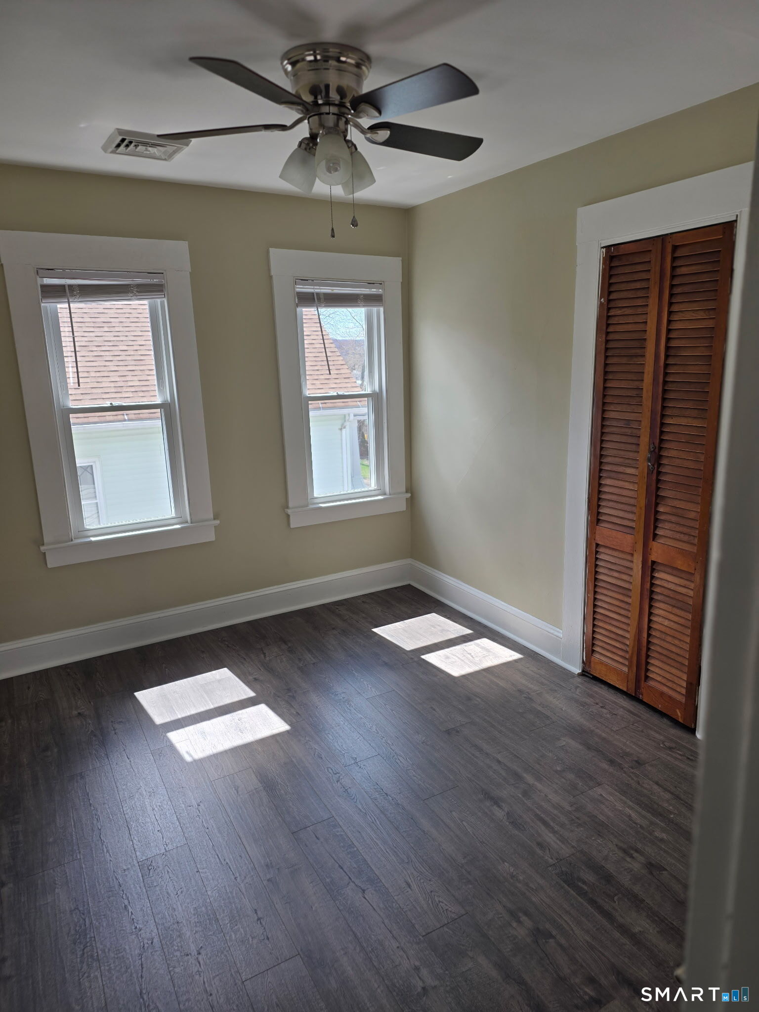22 Calvin Avenue Wallingford, CT 06492 - Photo 7 of 10 a view of empty room with wooden floor and fan