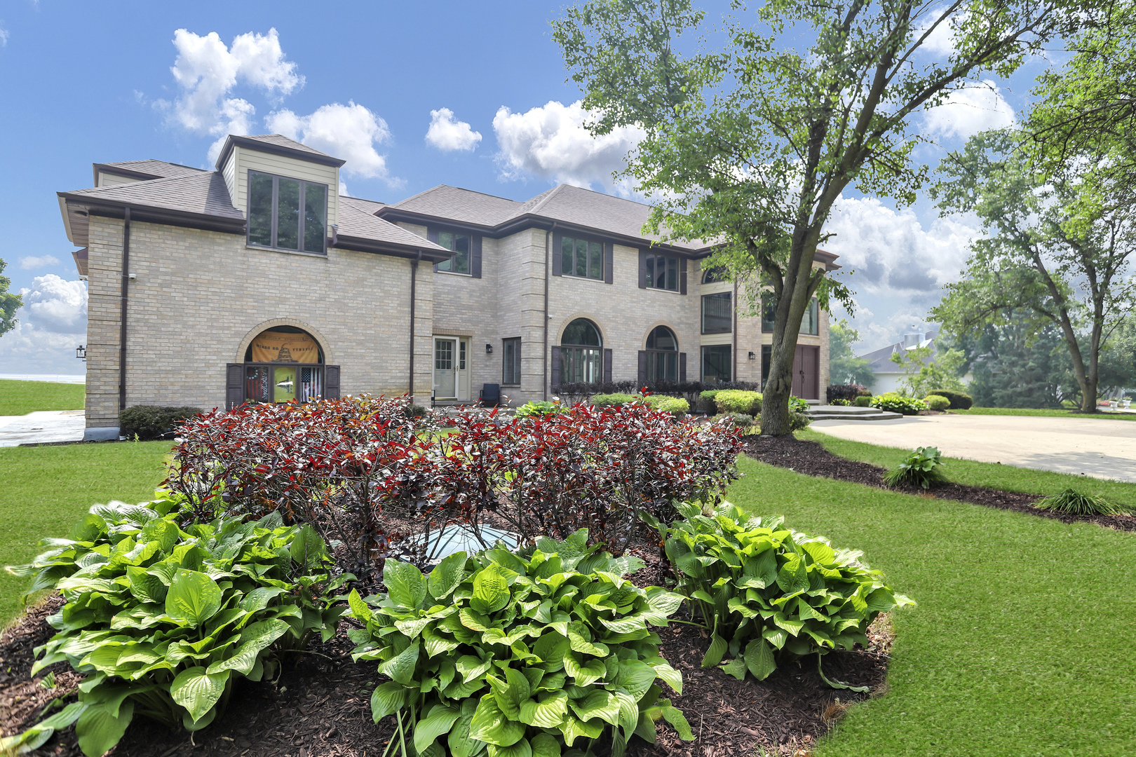 4N891 Honey Hill Circle Wayne, IL 60184 - Photo 2 of 57 a front view of a house with garden