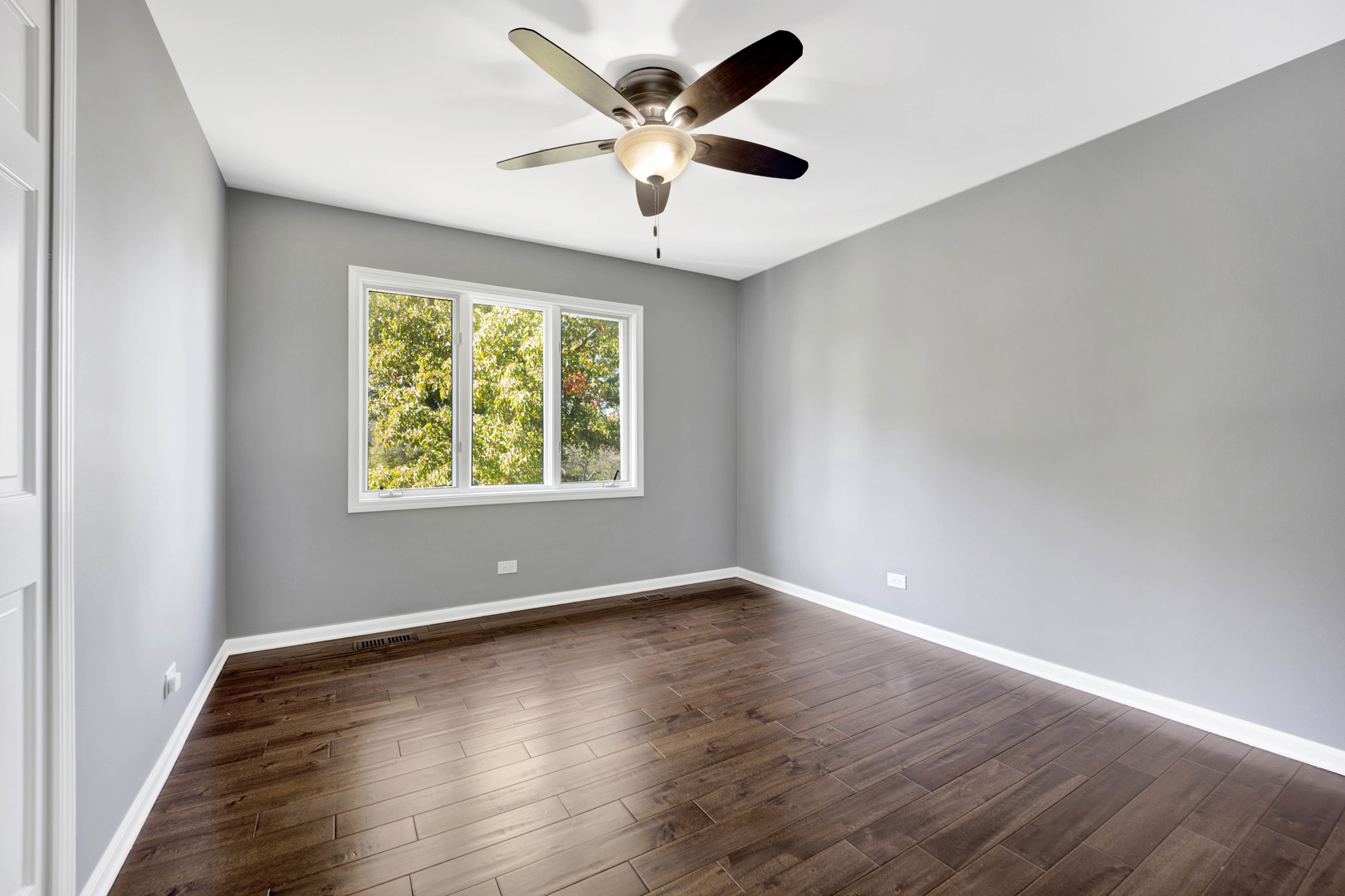 4N891 Honey Hill Circle Wayne, IL 60184 - Photo 33 of 57 an empty room with wooden floor and windows
