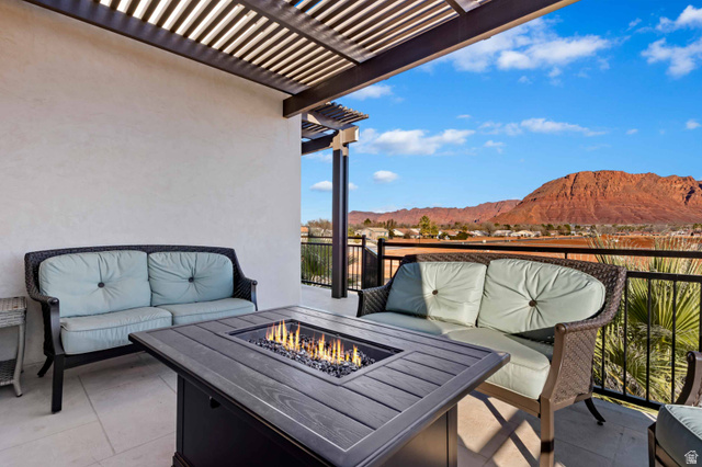 2600 Ocotillo Way, Unit 31 Santa Clara, UT 84765 - Photo 46 of 73 Outdoor patio with a slatted pergola, tile flooring, and a built-in fire pit