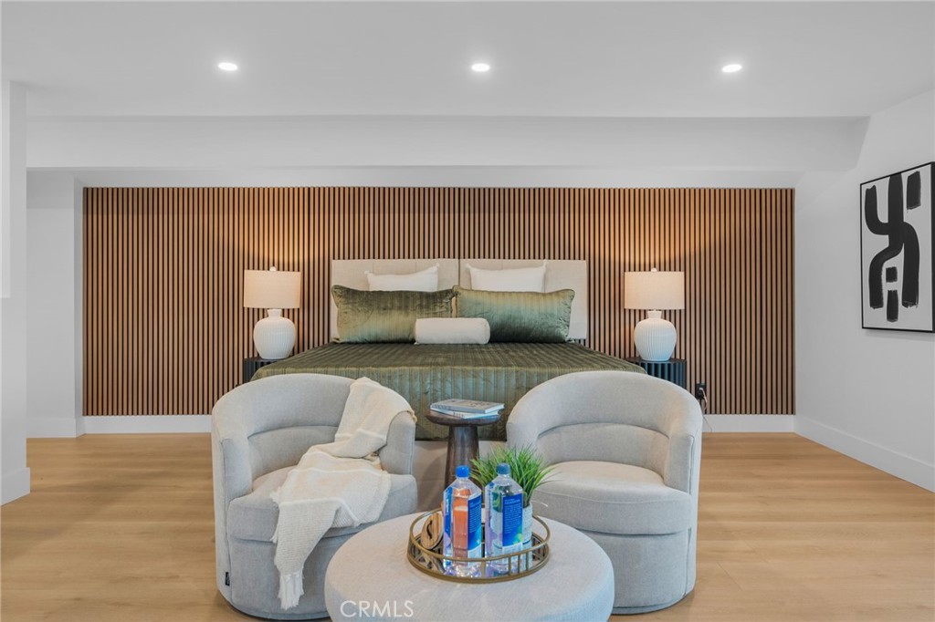 6210 Halstead Avenue Rancho Cucamonga, CA 91737 - Photo 2 of 9 a living room with furniture and a wooden floor