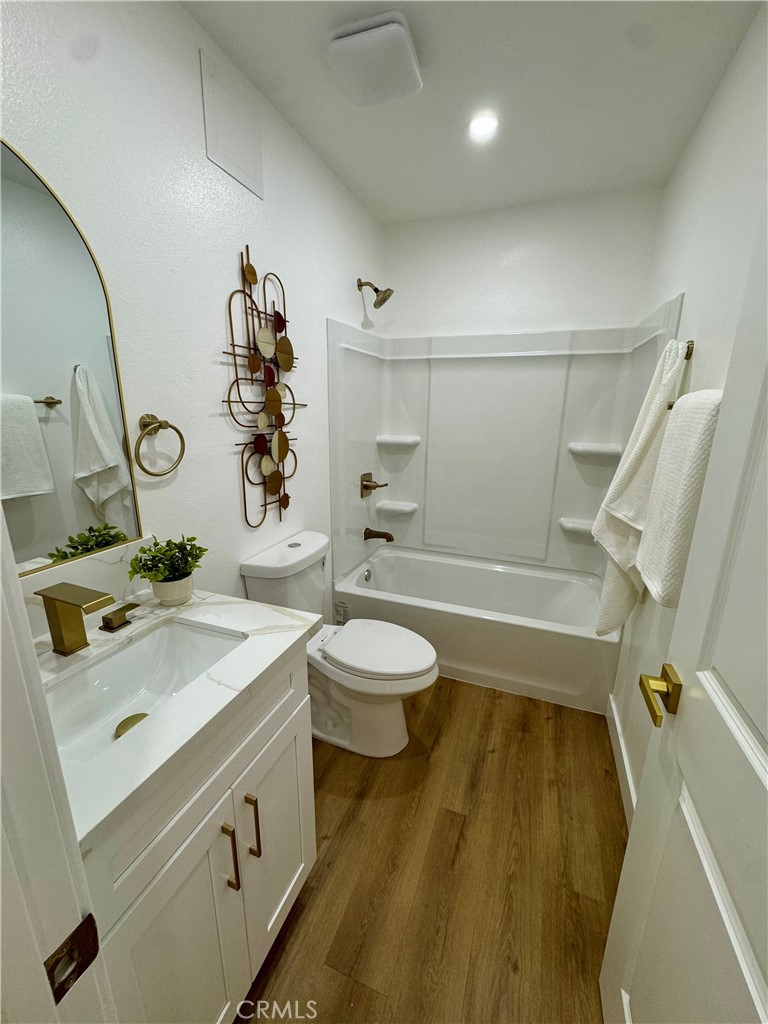 6210 Halstead Avenue Rancho Cucamonga, CA 91737 - Photo 7 of 9 a bathroom with a sink a toilet and shower