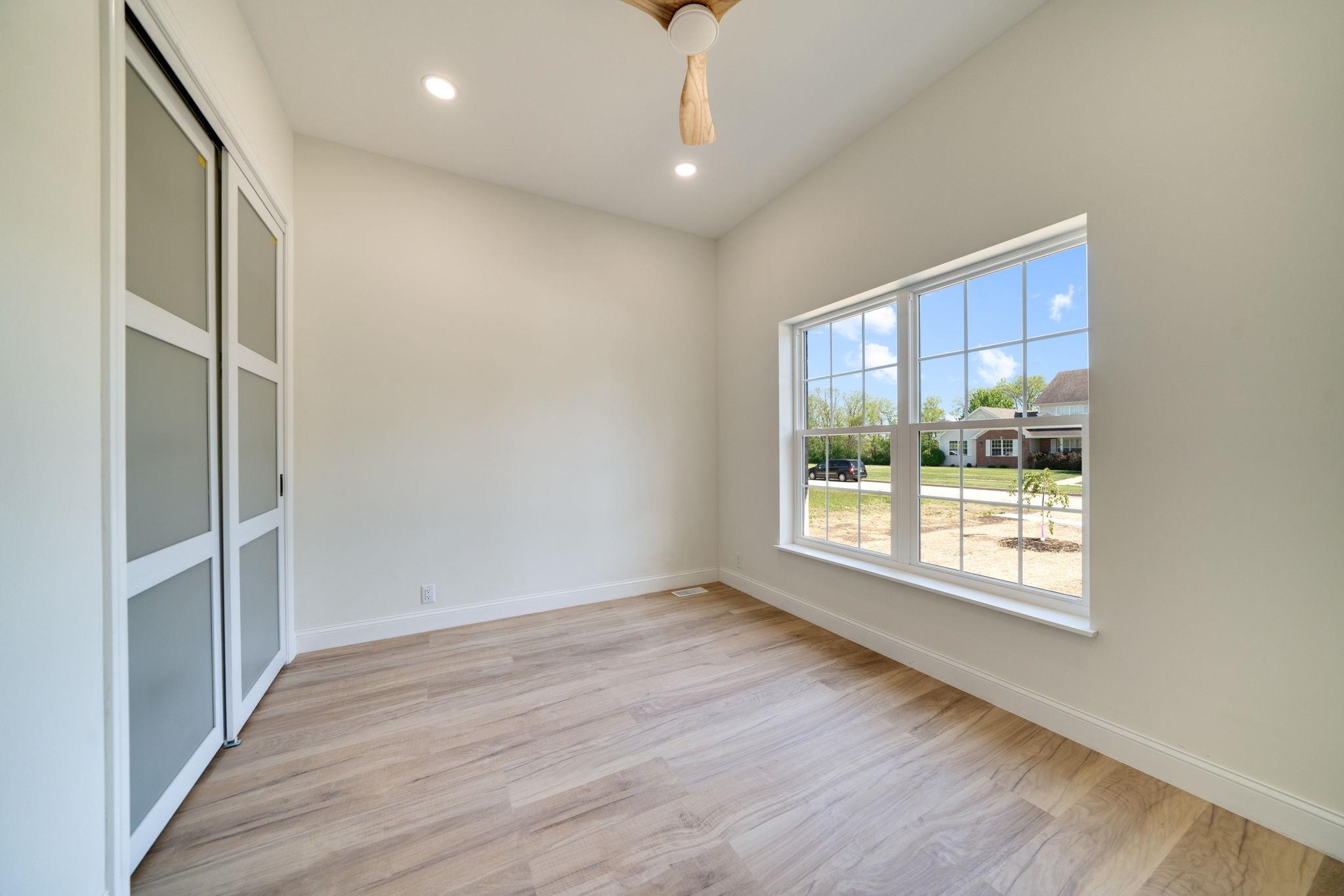 5145 Sycamore Ridge Road Belvidere, IL 61008 - Photo 29 of 57 a view of an empty room with a window and wooden floor