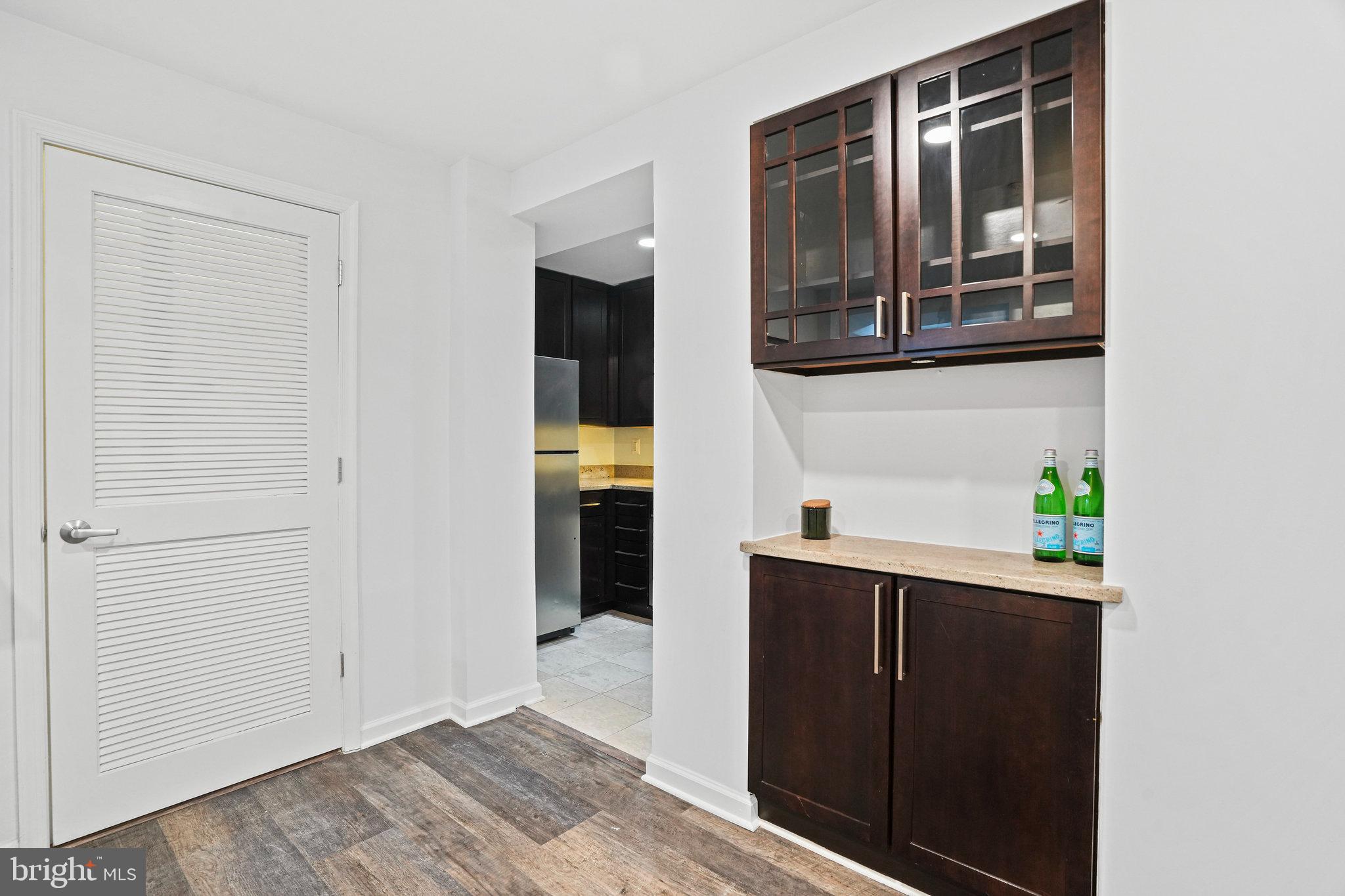 2627 Adams Mill Road Northwest, Unit T3 Washington, DC 20009 - Photo 13 of 19 a hallway with cabinet and entryway