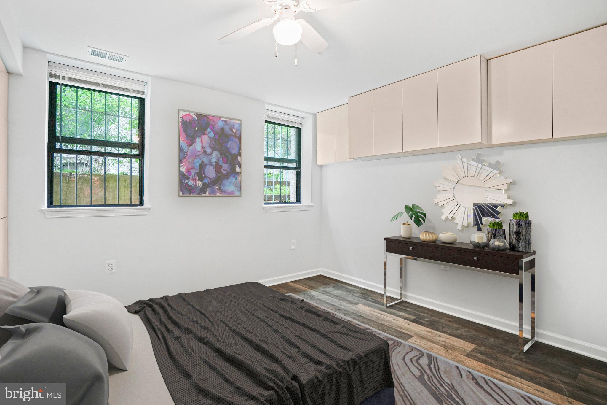 2627 Adams Mill Road Northwest, Unit T3 Washington, DC 20009 - Photo 15 of 19 a bedroom with a bed and a window