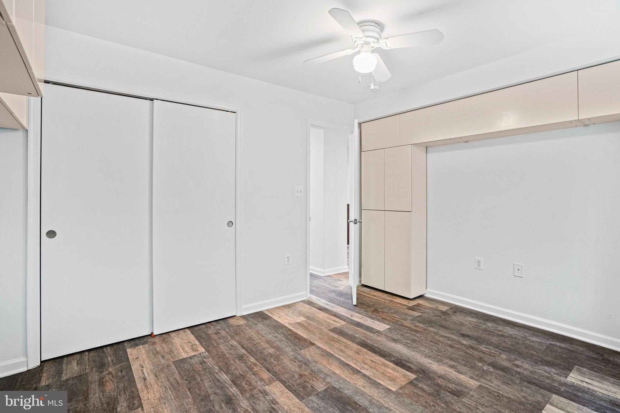 2627 Adams Mill Road Northwest, Unit T3 Washington, DC 20009 - Photo 16 of 19 a view of an empty room with wooden floor