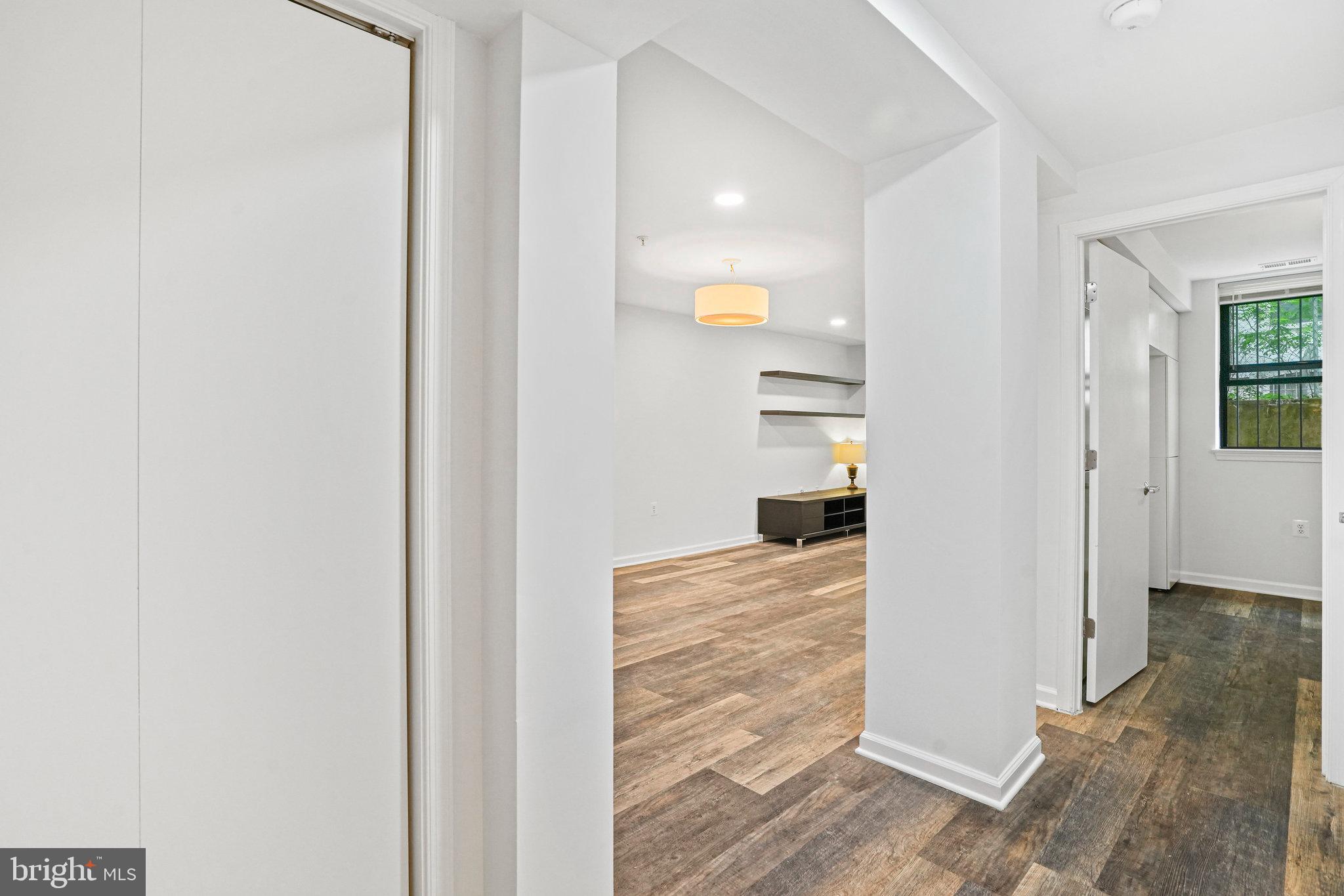 2627 Adams Mill Road Northwest, Unit T3 Washington, DC 20009 - Photo 4 of 19 a view of a hallway with wooden floor and entryway