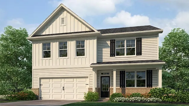 a view of a house with large windows and a yard
