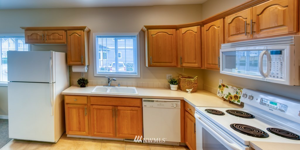 2731 Diamond Loop Milton, WA 98354 - Photo 11 of 28 a kitchen with a sink stove and cabinets