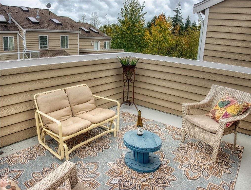 2731 Diamond Loop Milton, WA 98354 - Photo 23 of 28 a view of a patio with couches chairs and a potted plant