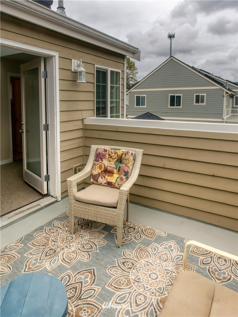 2731 Diamond Loop Milton, WA 98354 - Photo 25 of 28 a view of a white house with a bench in patio