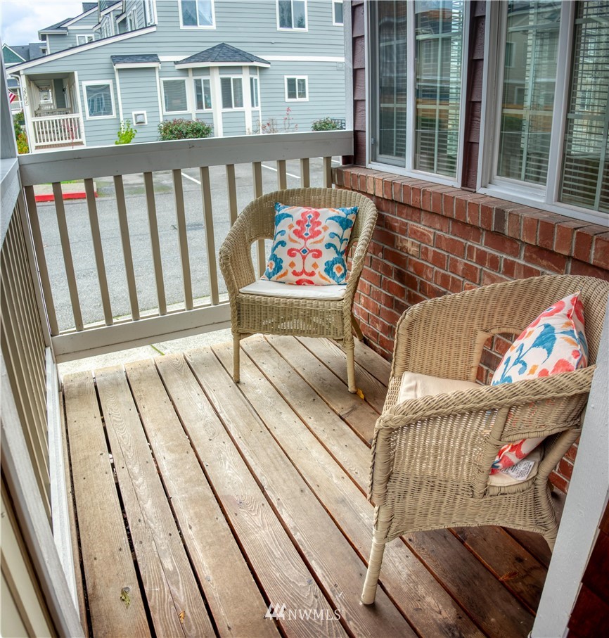 2731 Diamond Loop Milton, WA 98354 - Photo 3 of 28 a view of a patio with couches table and chairs and wooden floor