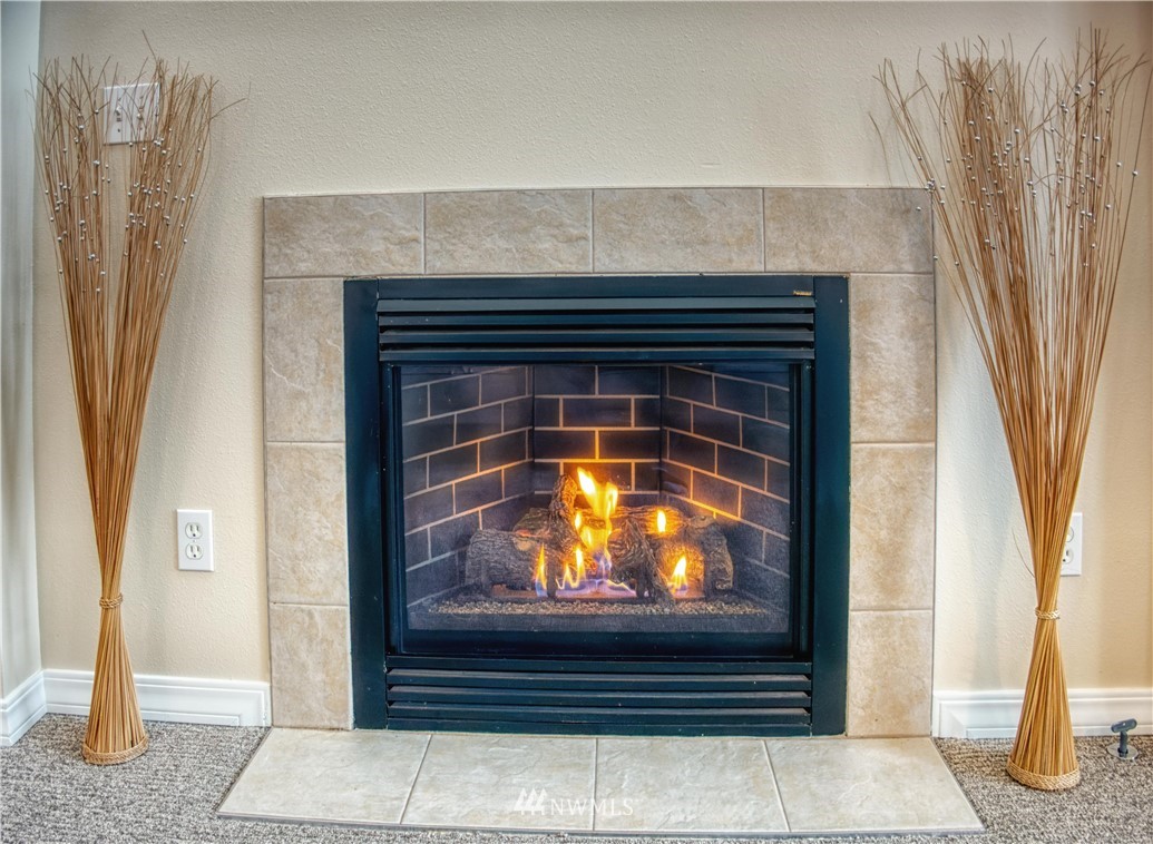 2731 Diamond Loop Milton, WA 98354 - Photo 5 of 28 a living room with a fireplace and a fireplace
