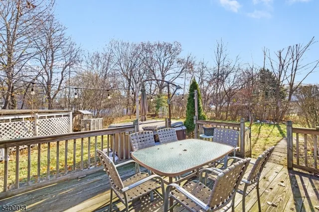 a view of balcony with furniture and trees