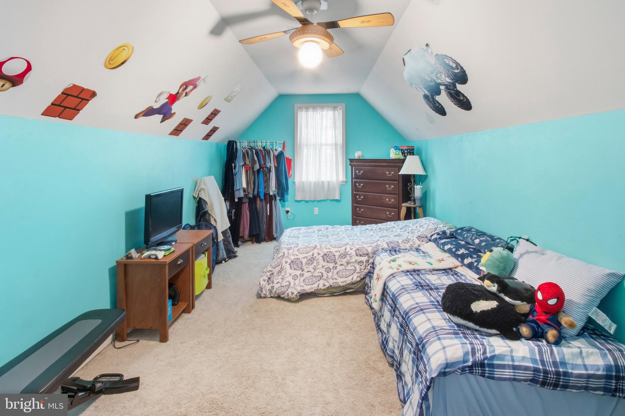 15 Hollybrook Road Mullica Hill, NJ 08062 - Photo 28 of 38 a bedroom with a bed and a chandelier