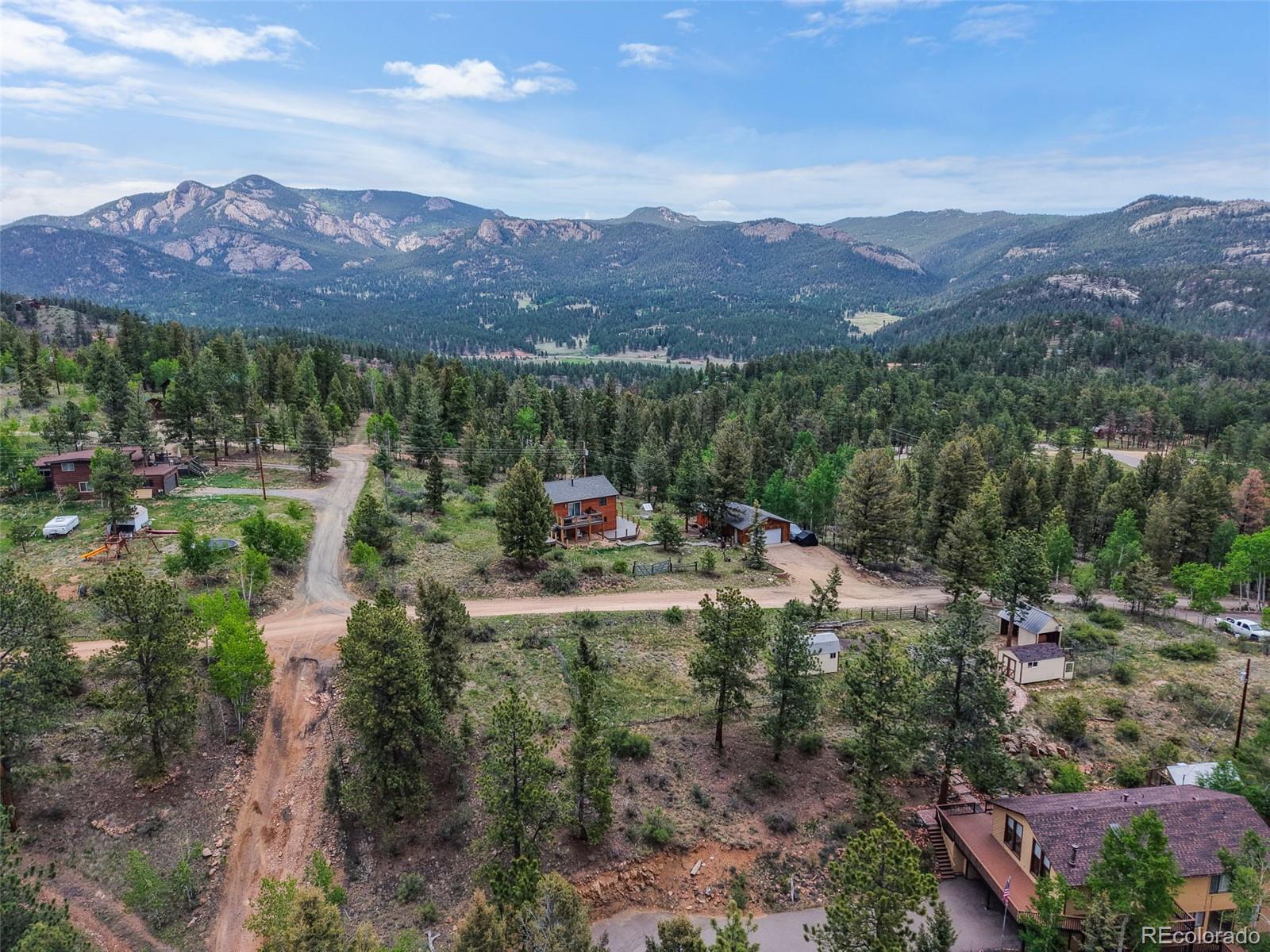 33799 Warren Road Pine, CO 80470 - Photo 5 of 50 a view of a town with mountains in the background