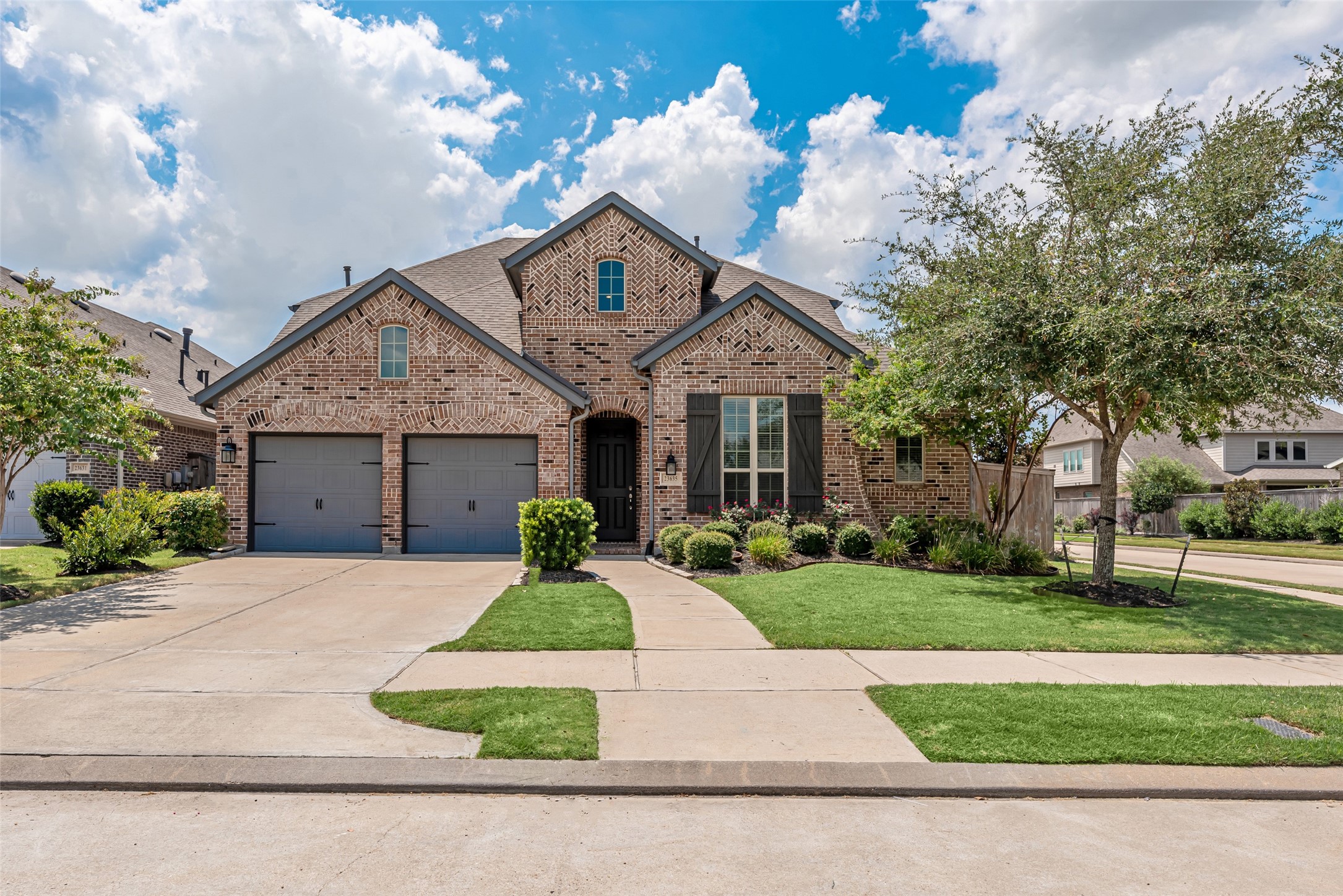 23635 Kingston Ridge Way Katy, TX 77493 - Photo 1 of 36 Welcome to your charming Corner Lot, two-story brick home situated in the highly sought after Elyson Community! Featuring a neatly manicured lawn, a double garage, and a welcoming front entrance