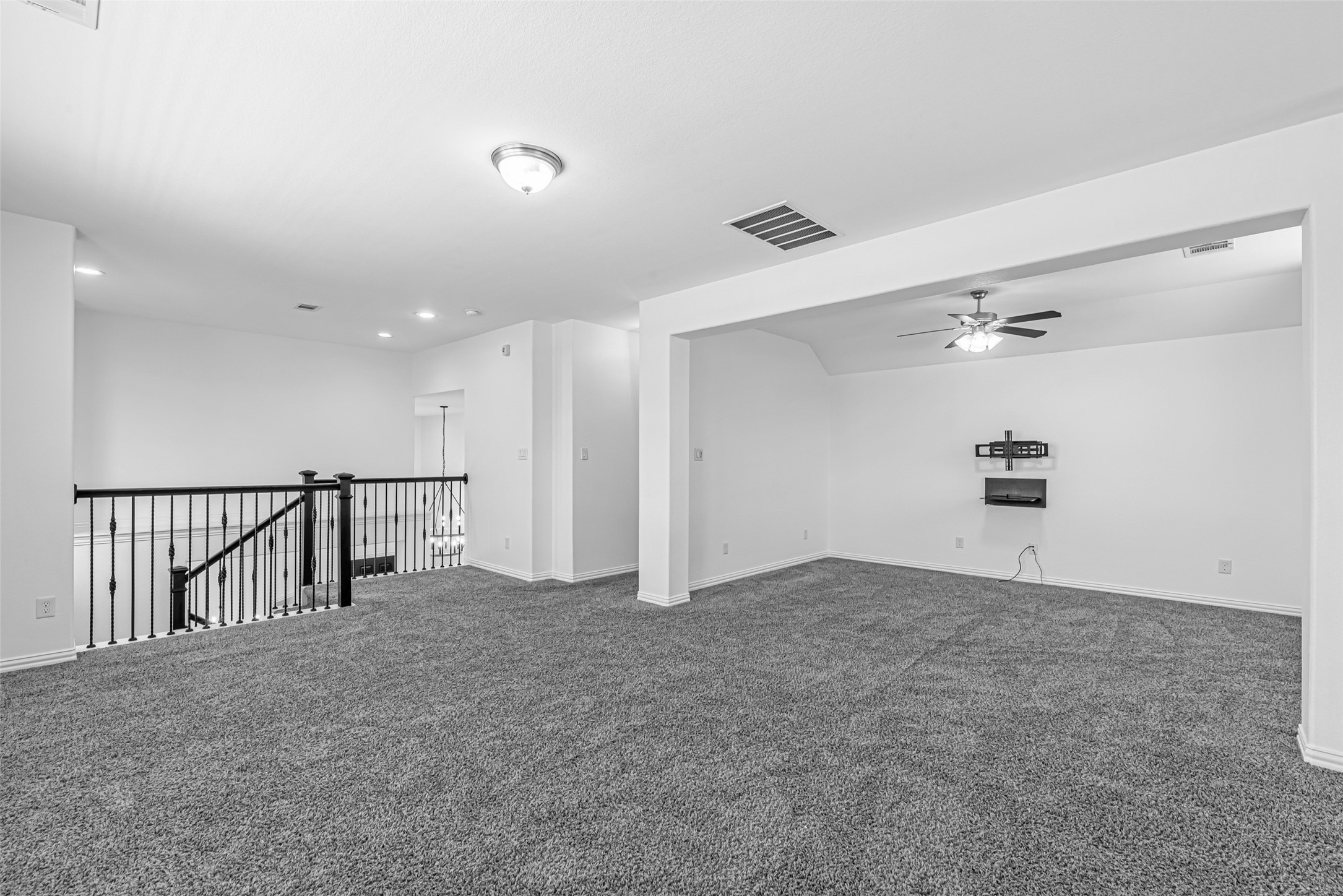 23635 Kingston Ridge Way Katy, TX 77493 - Photo 26 of 36 Immediately up the stairs you walk into your spacious, open layout family/game room offering a versatile space for entertainment or relaxation.