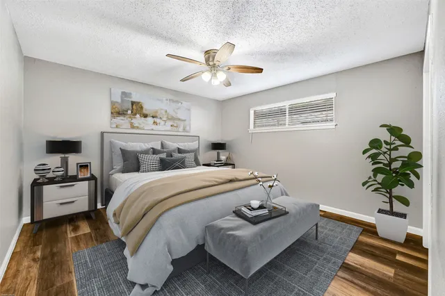 a bedroom with a bed and a couch