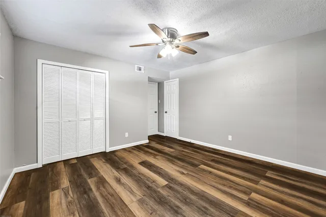 a view of room with window and ceiling fan