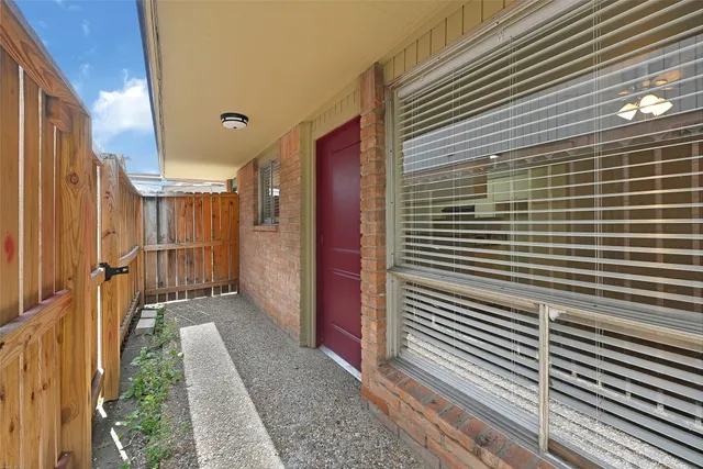 a view of a pathway with a bathroom