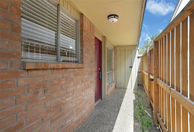 a view of a pathway of a house with wooden stairs