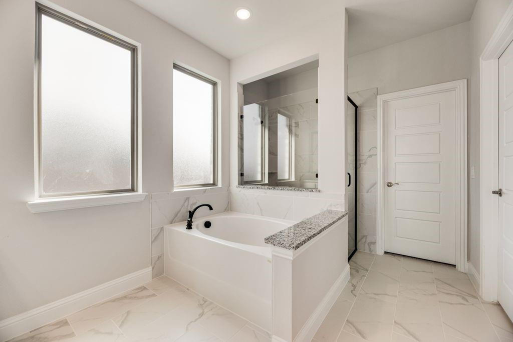 597 MB's Way Pilot Point, TX 76258 - Photo 24 of 34 a white bath tub sitting next to a window