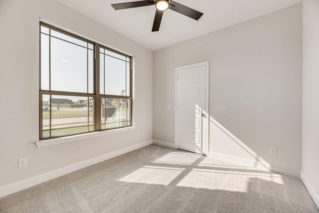 597 MB's Way Pilot Point, TX 76258 - Photo 29 of 34 an empty room with windows and fan