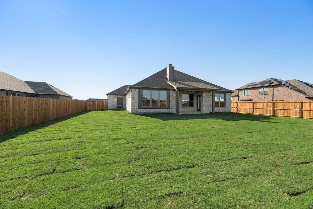 597 MB's Way Pilot Point, TX 76258 - Photo 3 of 34 a front view of a house with garden