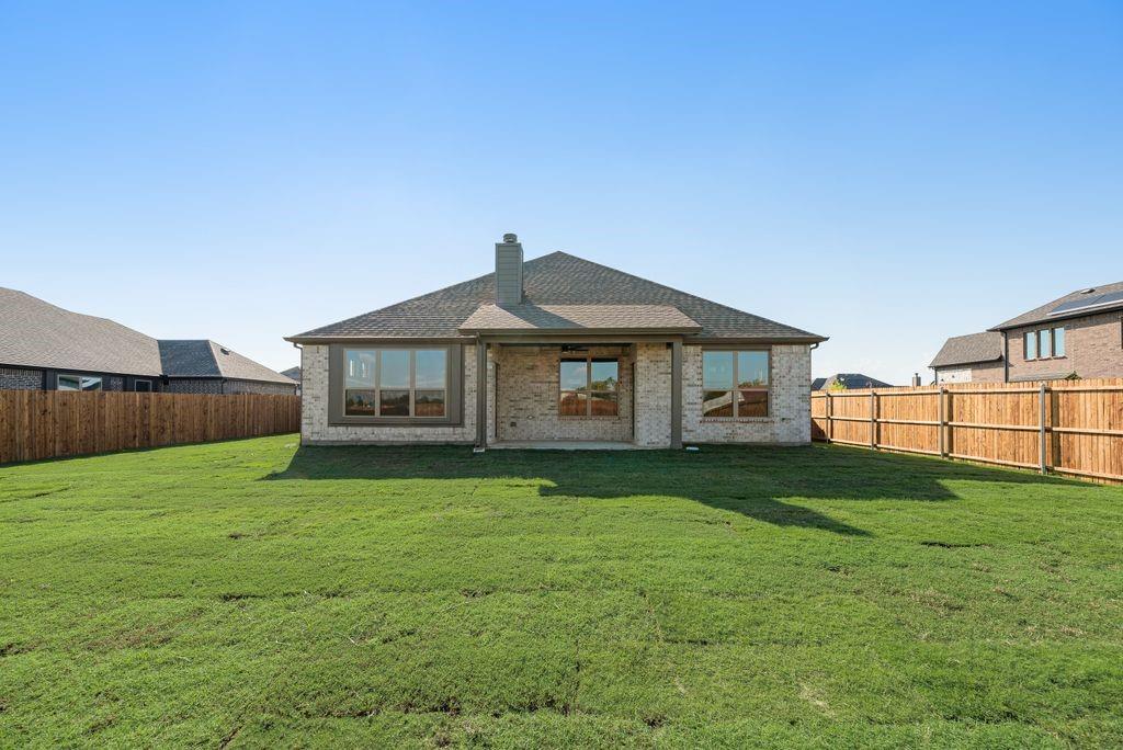 597 MB's Way Pilot Point, TX 76258 - Photo 34 of 34 a view of a yard in front of a house with large trees