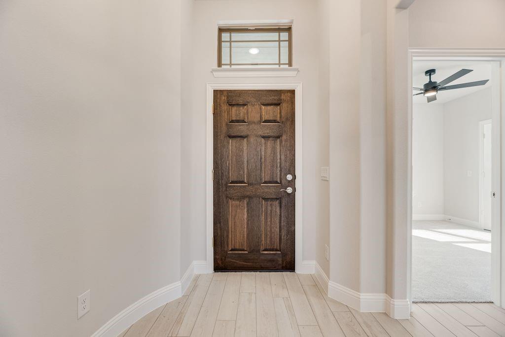 597 MB's Way Pilot Point, TX 76258 - Photo 8 of 34 a view of a hallway with wooden floor