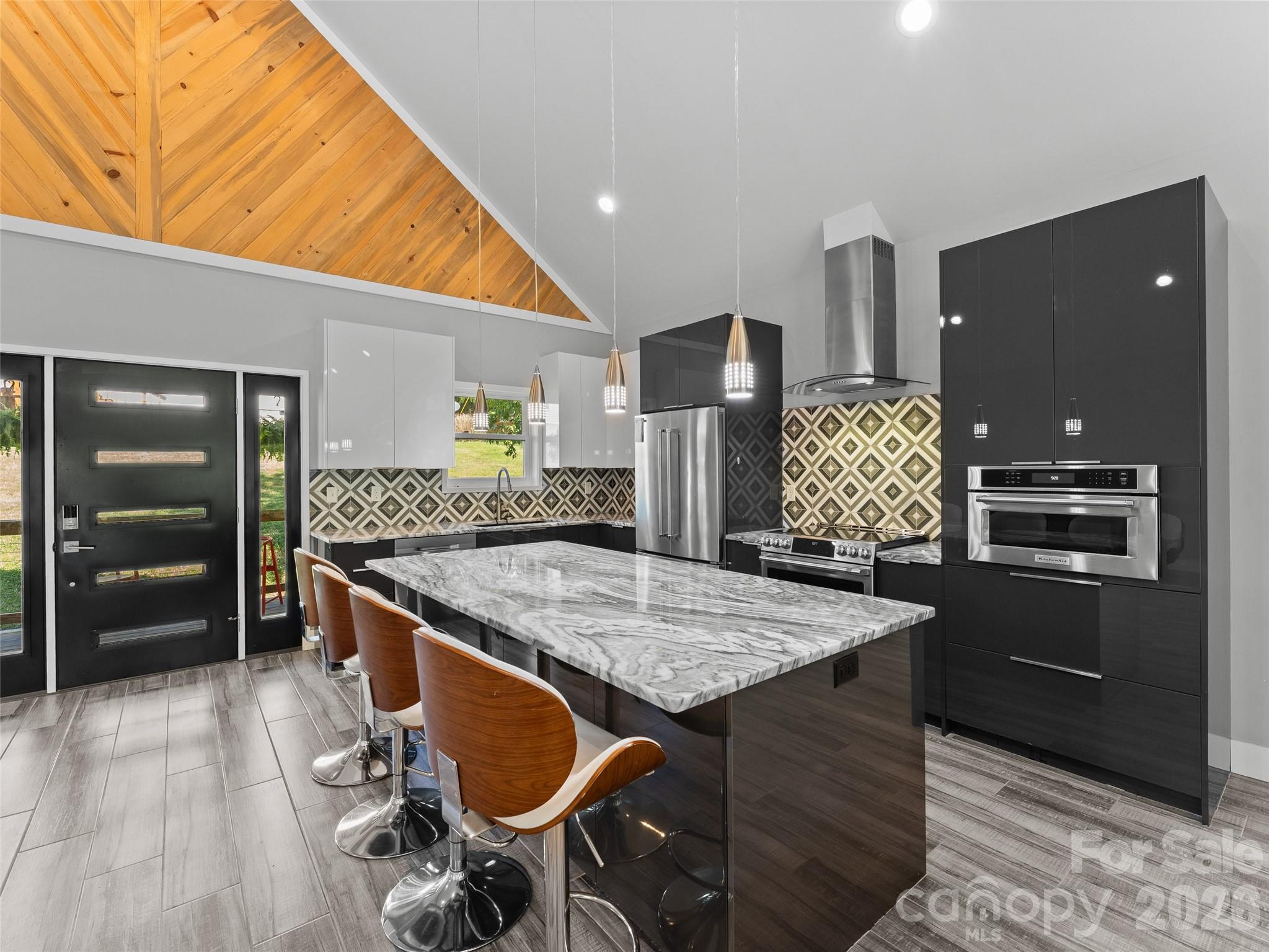 123 Israel Road Candler, NC 28715 - Photo 8 of 44 a kitchen with stainless steel appliances granite countertop a stove and a refrigerator