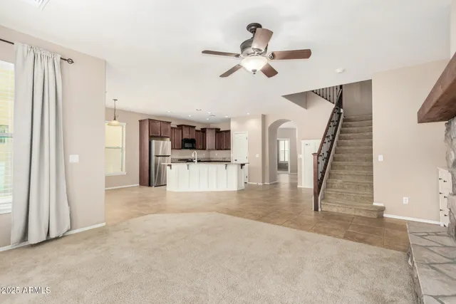 a view of a hallway with wooden floor and entryway