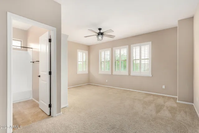 a room with gym equipment and a large window