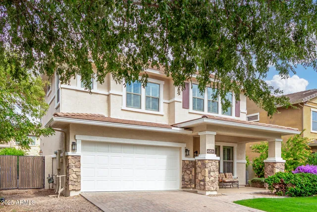 a front view of a house with garage